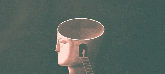 A man stands at the top of a ladder leading into a sculpture of a human head with a pill dropping into it.