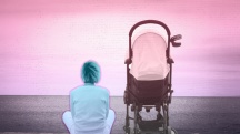 woman with blue tint sitting next to pink tinted stroller looking at the pink tinted sunset