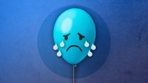 blue balloon with sad face crying on dark blue background