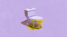 Yellow gel overflows out of a toilet.